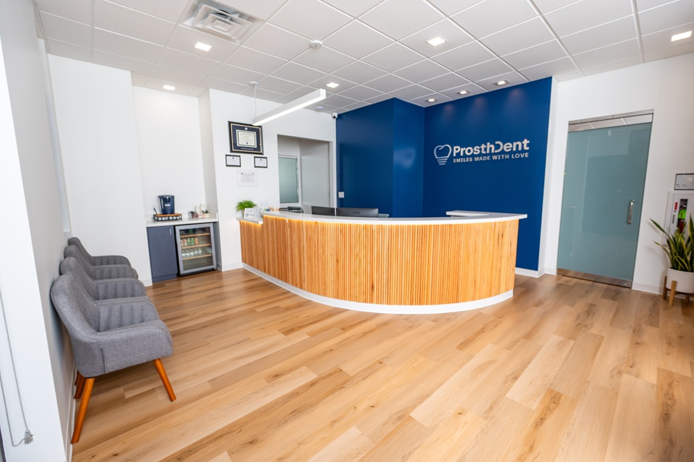 Reception area and front desk at ProsthDent by Rene Gonzalez, a prosthodontist office in Magnolia, TX